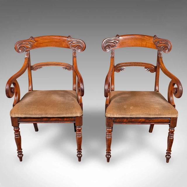 This is a fine pair of antique morning room chairs. An English, mahogany elbow seat, dating to the Regency period, circa...