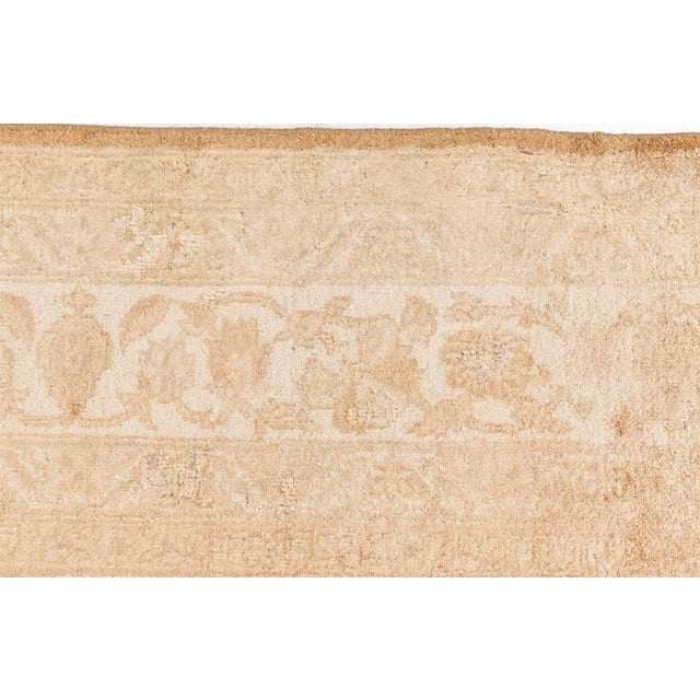 A late 19th century North Indian Amritsar antique rug, the cocoa field with an allover trellis of camel and cream palmette...