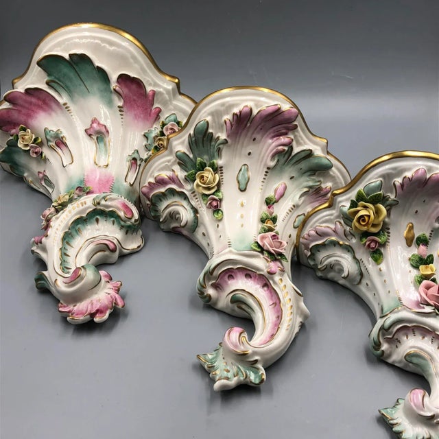 This exquisite set of three wall consoles comes from the renowned Kämmer porcelain manufacturer in Dresden and is designed...
