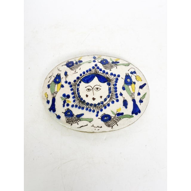 Glazed ceramic centerpiece, made in France in the 1930s. This handcrafted piece, with its naive charm, features a hand-...