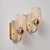 A pair of bubble glass wall lamps designed by Helena Tynell for Limburg in the 1960s. The lamps have organic shapes and...