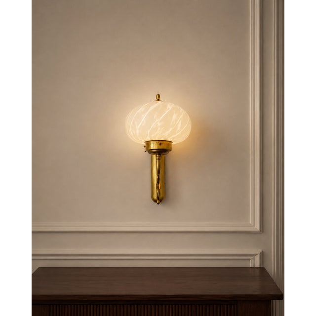 This exceptional mid-century italian wall sconce is a true masterpiece of venetian craftsmanship, manufactured by the...