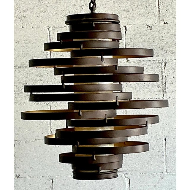 Make a bold architectural statement with this iconic vintage spiral ring chandelier. A masterful example of Mid-Century...