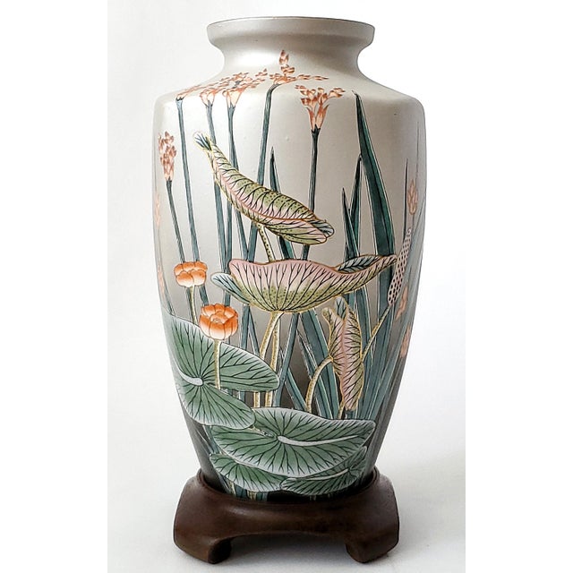 Offering an exquisite hand painted LARGE Chinese porcelain vase, circa Mid 20th Century. This gorgeous vase depicts two...