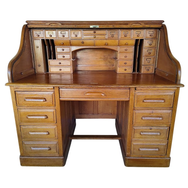 Impressive restored 1890s English roll-top desk in excellent condition for its age. This beautiful antique features a...