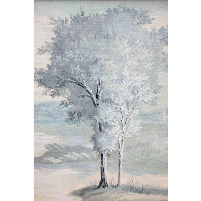 Framed vintage painting of a pair of trees in the foreground, with hills and the faint hint of a monastery in the...