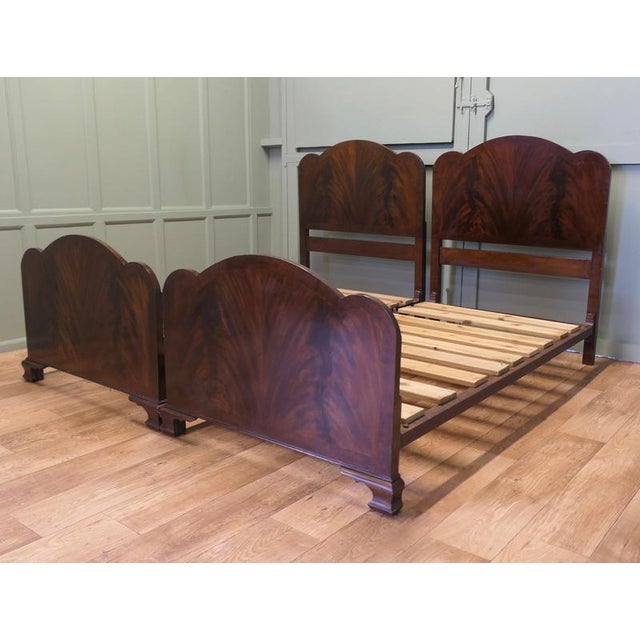 These are a very well matched pair, they are in an Odeon style, the head boards have a waved top matching the foot board...