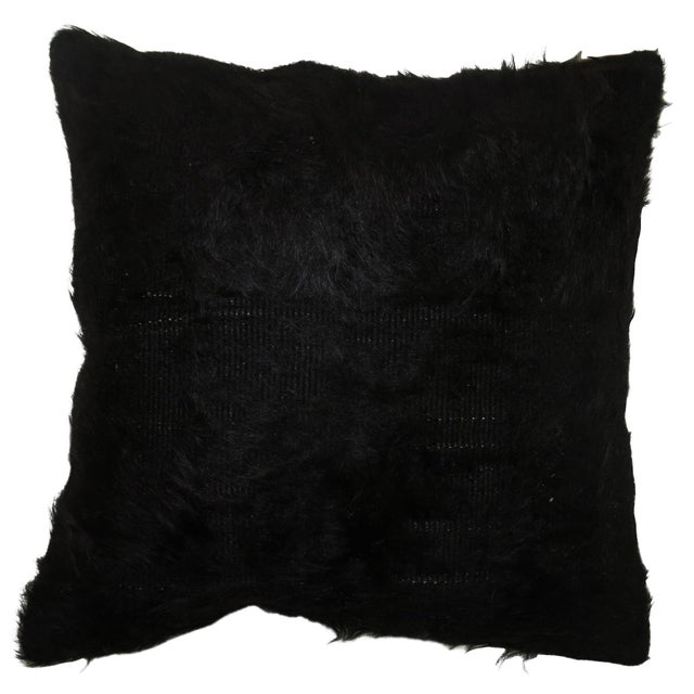 A pillow made with a Turkish Mohair rug. Measures: 15” x 15”.