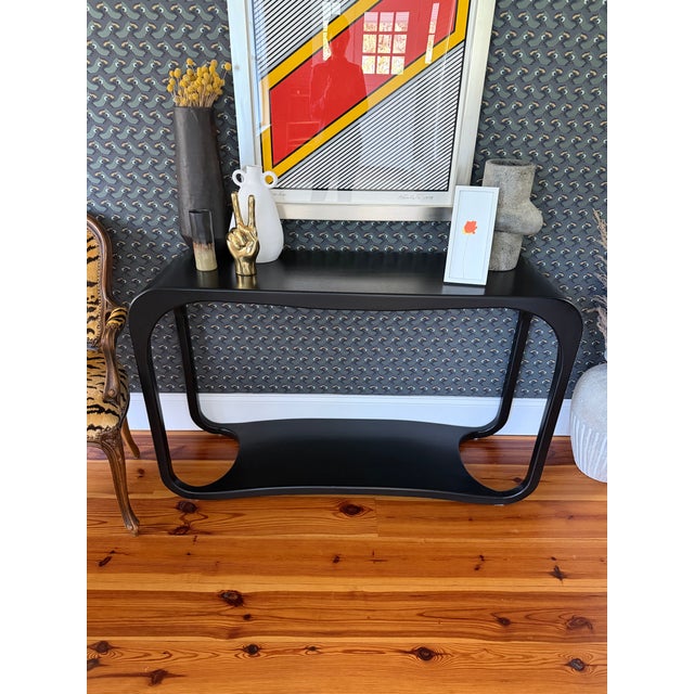 The Milena Console from Noir Furniture. Hand rubbed black mahogany wood. Unmarked but 100% authentic Noir. Purchased...