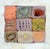 A highly textural abstract expressionist painting with square patches of varied color, shape, and texture by Kathryn...