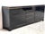 Luxurious seventies glamour sideboard by Jean claude Mahey consitsing of black lacquer panels and brass. The use of...