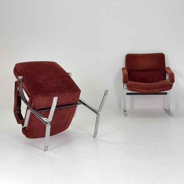 Beautiful one of two mid-century lounge chairs made in Italy in the 1980s. These striking chairs combine the elegance of...