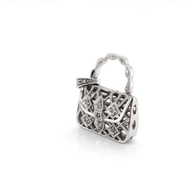 Add a touch of whimsical elegance to your collection with this authentic Diamond 14k White Gold Purse Charm Pendant....
