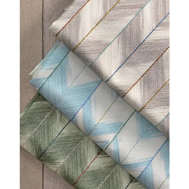 This full-coverage embroidery uses a space-dyed yarn with a distinct thread stitched in highlight colours. The arrow-tip...