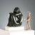 Marble sculpture depicting a stylized female nude, featuring fluid, sinuous, modernist-inspired forms that create an...