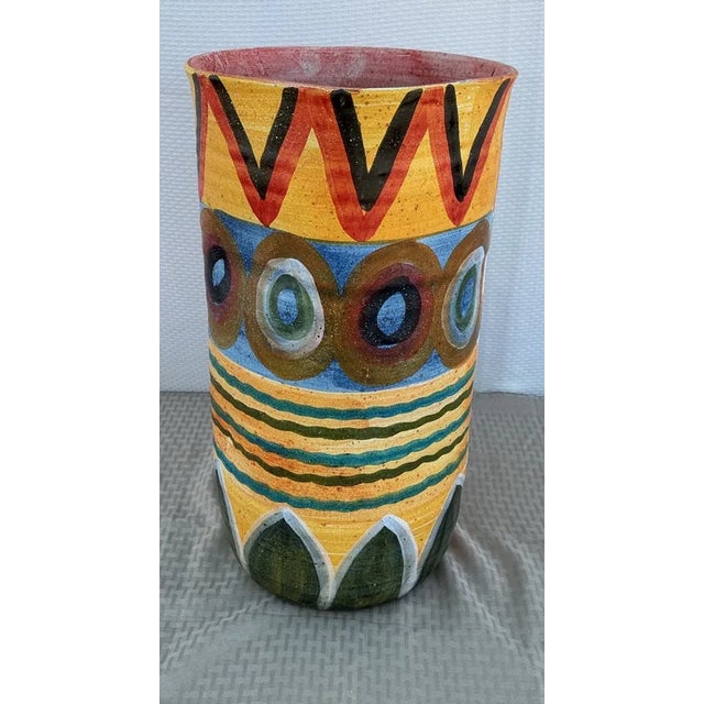 Design & Aesthetic: A striking mid-century modern ceramic vase by the renowned Italian studio Italica Ars. This piece...