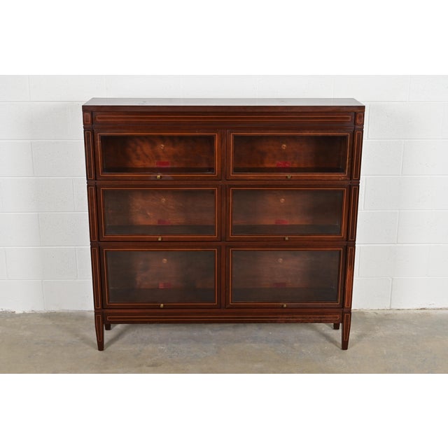 A gorgeous antique Arts & Crafts three-stack double barrister bookcase By Globe Wernicke USA, Circa 1900 Mahogany, with...