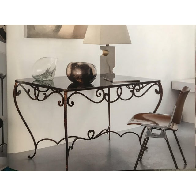 Classic meets modern! 1930s French Art Deco wrought iron table with black glass top.