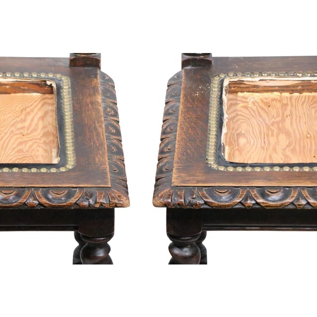 Set of four antique dining chairs executed in the Tudor, William and Mary Revival, Victorian style, constructed of solid...