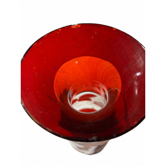 A beautiful antique Victorian art glass vase dating to approximately 1890–1910. This elegant cabinet vase features a rich...