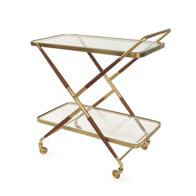 Featuring a sleek gold-finished frame with wrapped wood detailing and two tempered glass shelves, it offers ample space...