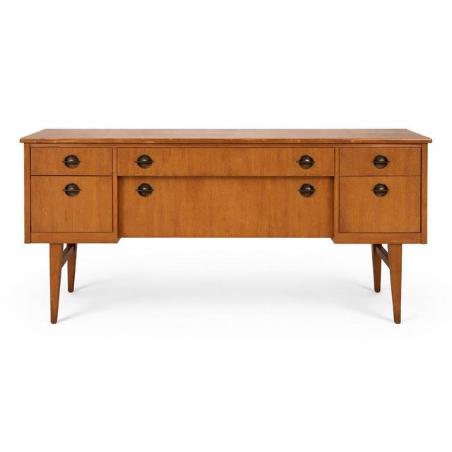 A classic mid-century Austinsuite teak sideboard, showcasing the clean lines and practical design that made British mid-...