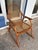 The 1970s Vintage Snowshoe Oak Rocking Chair by Vermont Tubbs is a fully assembled antique chair made of brown oak....