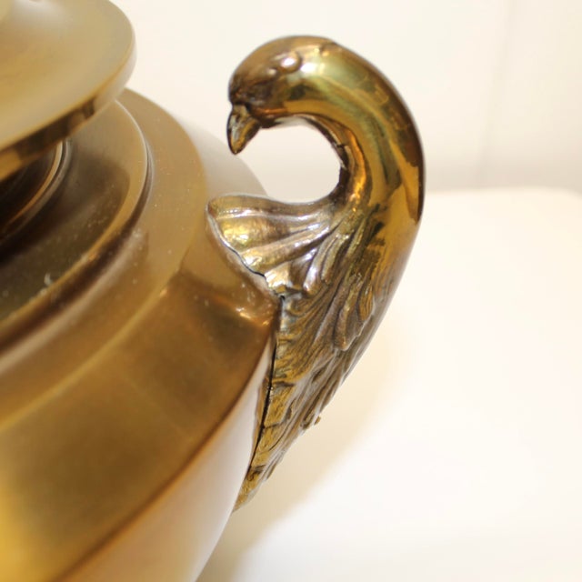 Classic bronze squat urn table lamp with nice patina and 2 swan heads on either side.