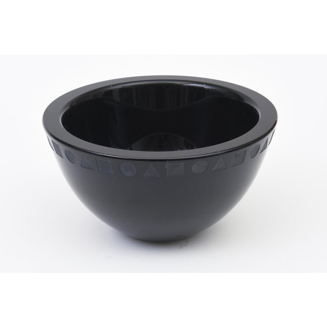 This lovely vintage 1980's postmodern black glass bowl was designed by Ward Bennett for Sasaki.It has geometric circles...