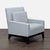 This West Elm lounge chair features a clean and modern design, upholstered in light blue fabric. The chair has comfortable...
