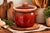This vintage Hull Pottery oven-proof bean pot with lid showcases the warm earthy tones and functional design that made...