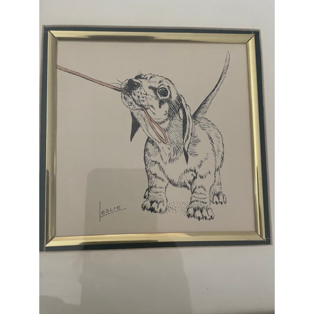 Vintage 1970s/80s signed print of a pen and ink drawing of a naughty dachshund or basset hound puppy drawn by Leslie Cope....