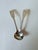A pair of monogrammed antique sterling silver "Fiddleback" design salt spoons made by Thomas Johnson, a London-based...