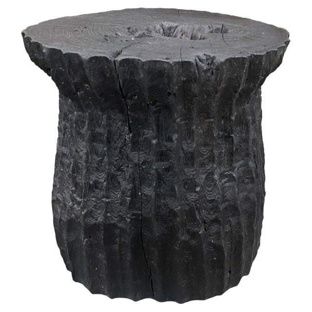 Beautiful hand carved minimalist teak wood charred side table. We have a collection in different shapes and sizes. The...