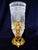 Strikingly theatrical in silhouette and surface, this Belle Époque decorative vase is constructed around a tall,...