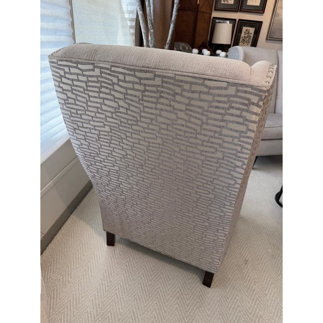 This gorgeous chair is from Sam Moore Furniture and is in a two-toned fabric with nail-head trim. The color is a silver...