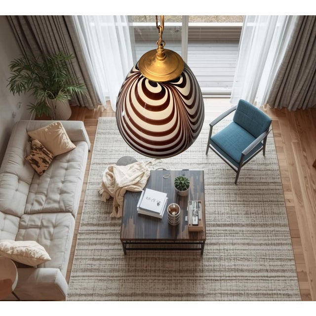 Crafted hand-blown Murano glass, this striking pendant light showcases the artistry and tradition for which the island is...