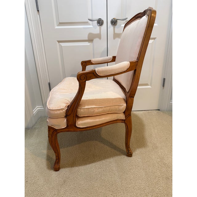 Attractive carved Louis XV-style armchair upholstered in peach silk. Usable immediately but also easy to recover. Some...