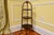 A 19th century English three-tiered mahogany muffin stand, traditionally used by hotels and bakeries, with a ball-shaped...