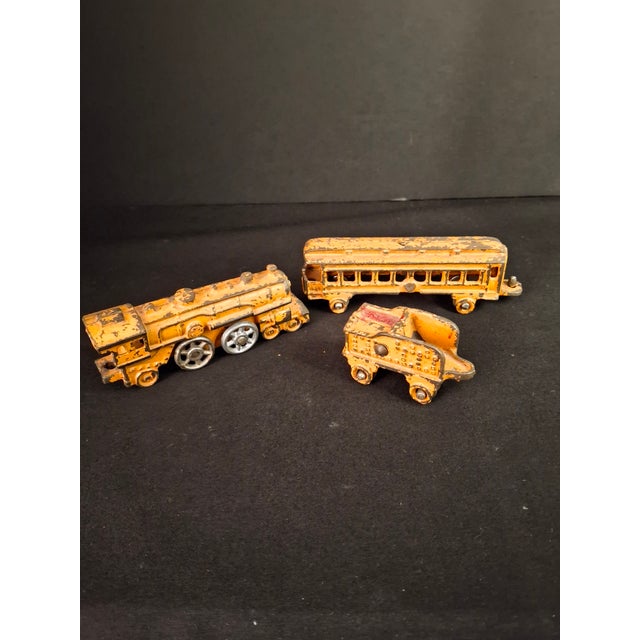 Up for sale is an antique 3-piece cast iron miniature floor train set manufactured by the Kilgore Manufacturing Company...