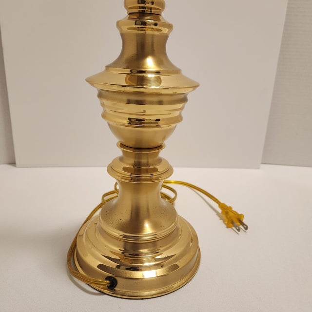 Bring classic Hollywood Regency or Newstalgia sophistication to your space with this solid brass candlestick table lamp by...
