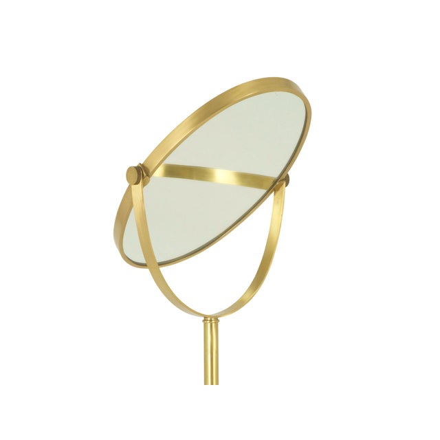 This freestanding floor mirror was designed and produced in Italy around the 1960s. It is made from frosted brass and...