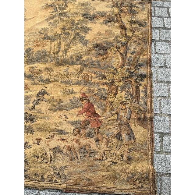 "Discover the timeless elegance of this exquisite vintage French tapestry featuring a hunting with hounds scene. A noble...