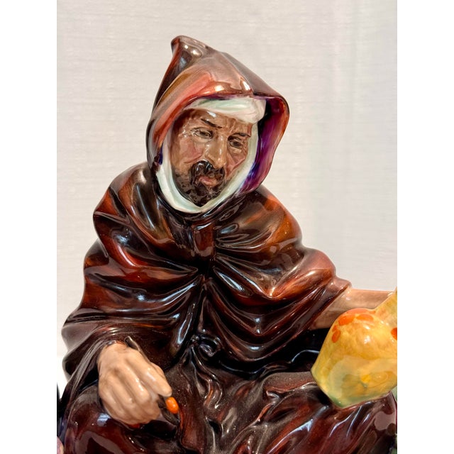 A soulful tribute to the ancient art of ceramics, "The Potter" (HN 1493) is a masterwork of mid-century English porcelain....