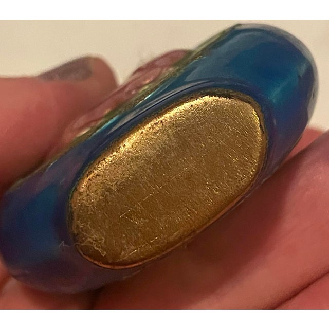 What a colorful enamel snuff bottle with a cat chasing a butterfly on the front and back which would be perfect for...