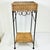 This wicker and metal Plant Stand from the 1980s features the iconic Mid-Century design element of twisted rope metal....