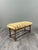 Charming antique bench resting on an elegant turned wood base in the "barley twist" style, connected by a similarly...