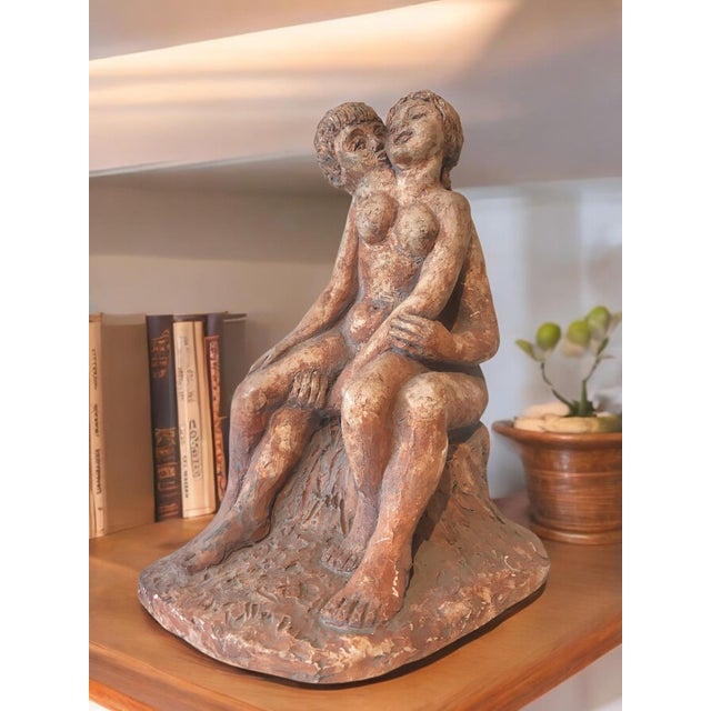 Hand-modeled embracing lovers sculpture. The romantic figures were hand-modeled in clay, then cast from plaster to create...