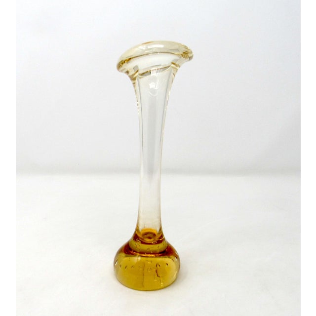 A 1960s hand-blown amber Aseda Glasbruk "Bone" vase with controlled bubbles. This vase was hand blown in Sweden and...