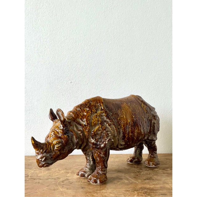 This striking vintage Italian rhinoceros is a masterful example of 1960s majolica tradition, blending bold animalia with...